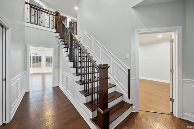 stairs with hardwood / wood-style floors