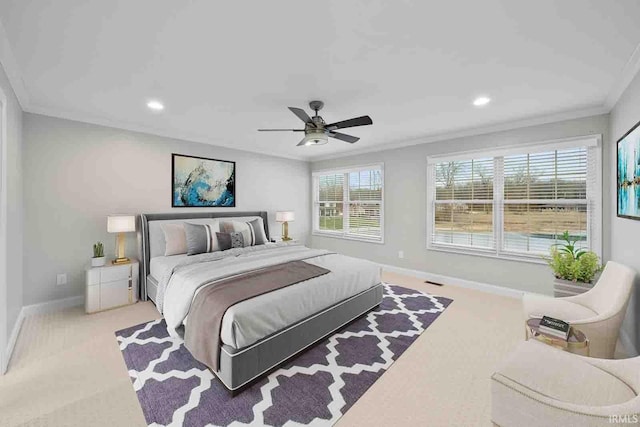 bedroom with light carpet, ceiling fan, and ornamental molding