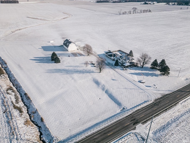 birds eye view of property with a rural view