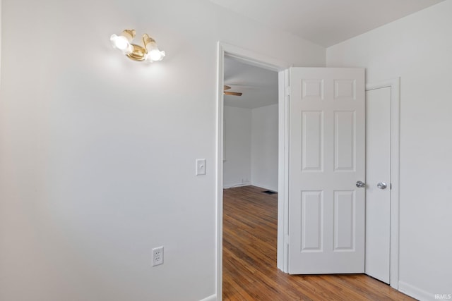 hallway featuring wood-type flooring