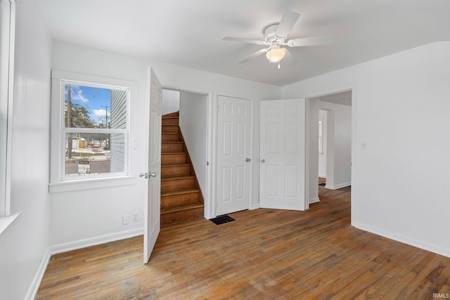 interior space with hardwood / wood-style floors and ceiling fan