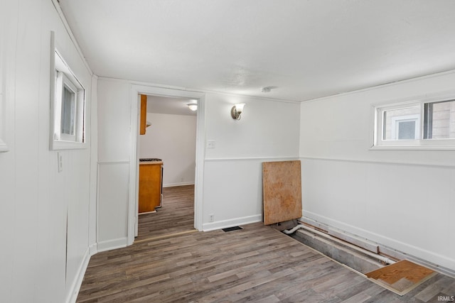 spare room featuring dark hardwood / wood-style flooring