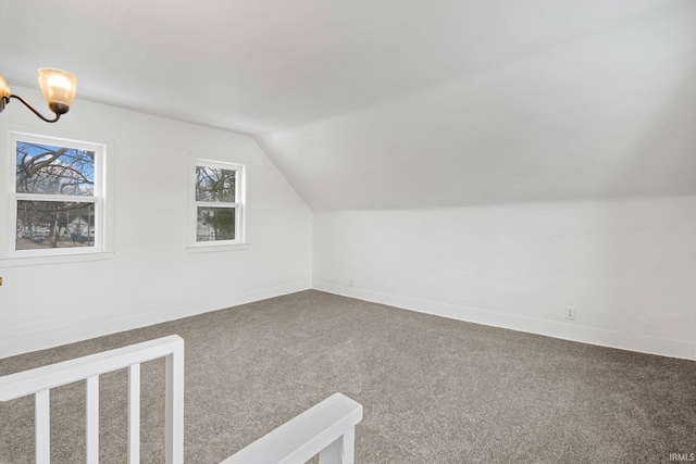 bonus room featuring carpet flooring and vaulted ceiling