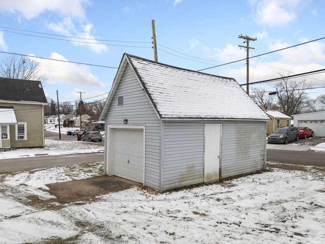 view of snow covered garage