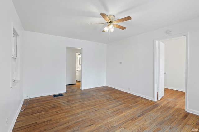 unfurnished room featuring ceiling fan and hardwood / wood-style flooring