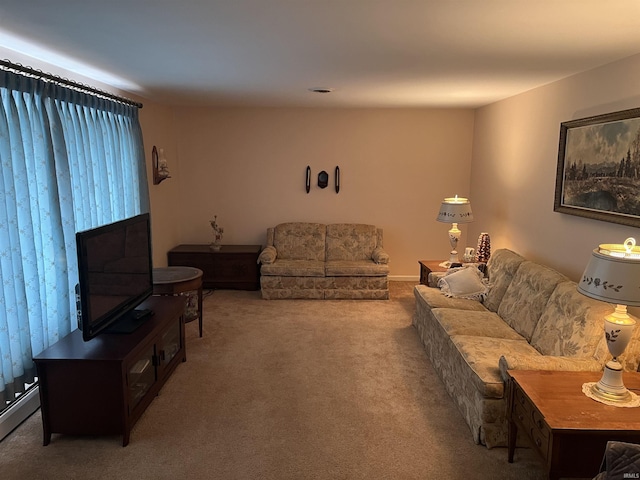 carpeted living room featuring a baseboard heating unit