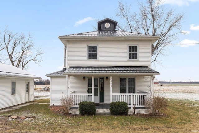 view of front of house featuring a porch and a front yard