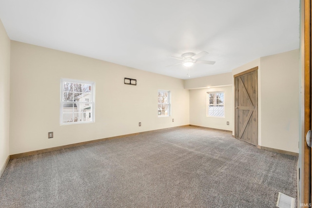 carpeted empty room with ceiling fan