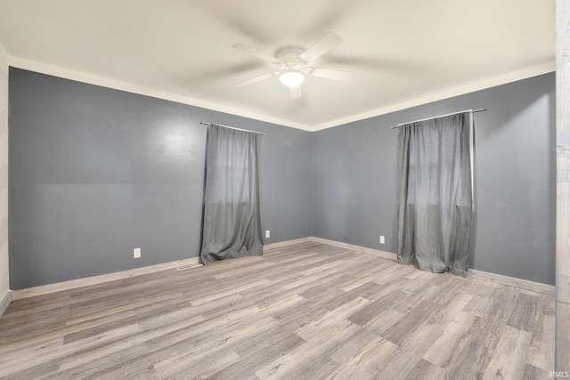 unfurnished room featuring light hardwood / wood-style flooring, ceiling fan, and crown molding