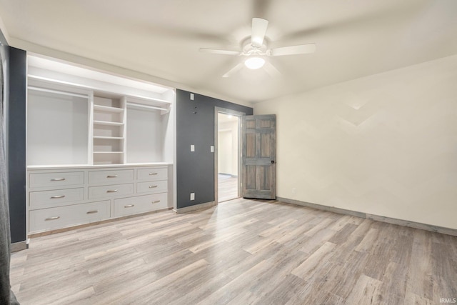 unfurnished bedroom with ceiling fan, a closet, and light hardwood / wood-style flooring