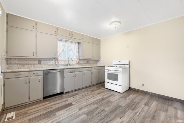 kitchen with backsplash, sink, light hardwood / wood-style flooring, stainless steel dishwasher, and gas range gas stove