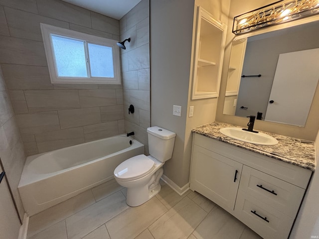 full bathroom with tile patterned floors, vanity, toilet, and tiled shower / bath