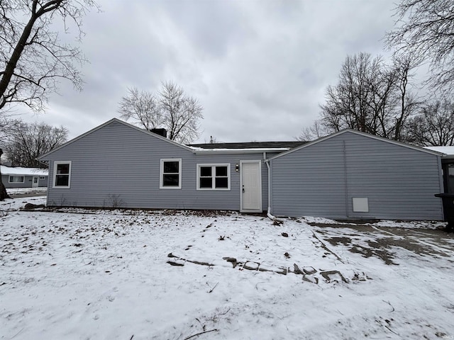 view of snow covered house