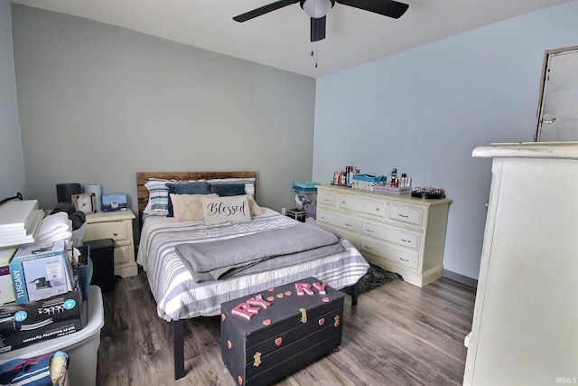 bedroom featuring dark hardwood / wood-style flooring and ceiling fan