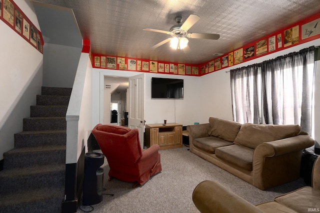 carpeted living room featuring ceiling fan