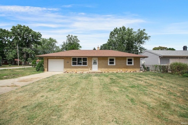 single story home featuring a garage and a front yard