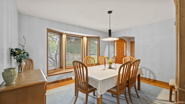 dining space with light hardwood / wood-style flooring