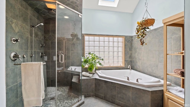 bathroom featuring tile patterned floors, a skylight, and plus walk in shower