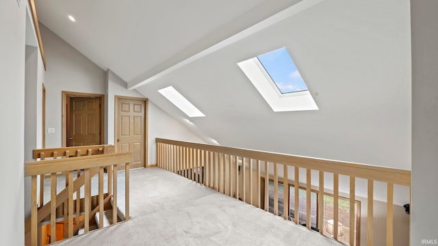 bonus room with carpet floors and lofted ceiling with skylight