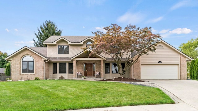 view of front of property featuring a garage and a front lawn