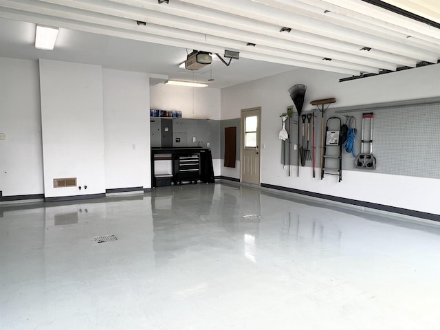 garage featuring a garage door opener