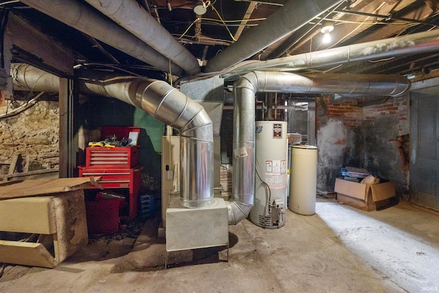 utility room featuring gas water heater