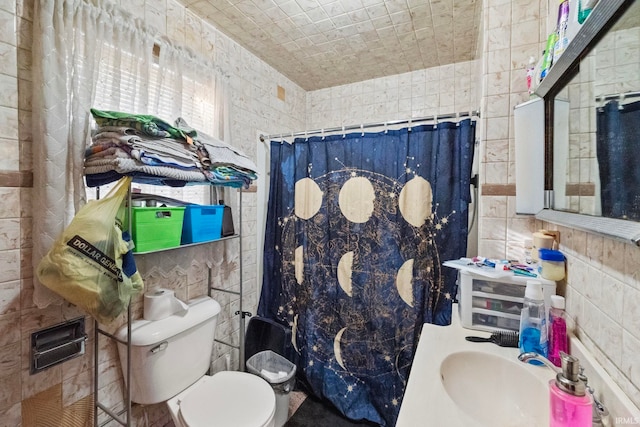 bathroom featuring walk in shower, sink, and toilet