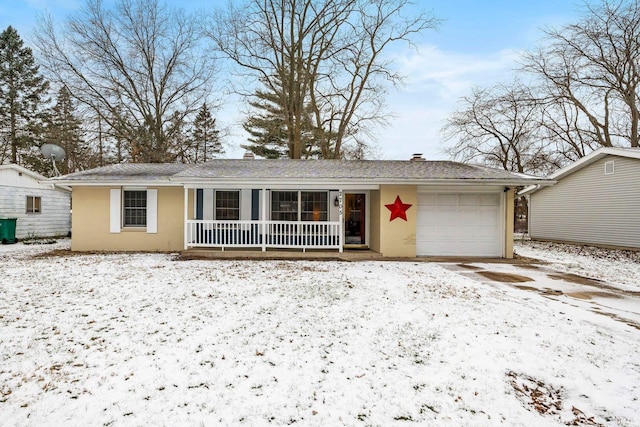 view of front of home featuring covered porch and a garage