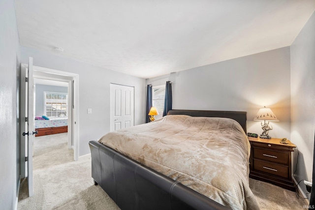 carpeted bedroom featuring a closet