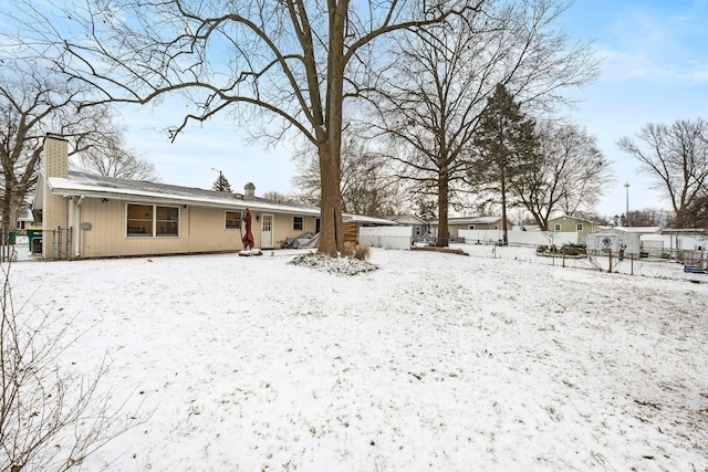 view of snow covered property