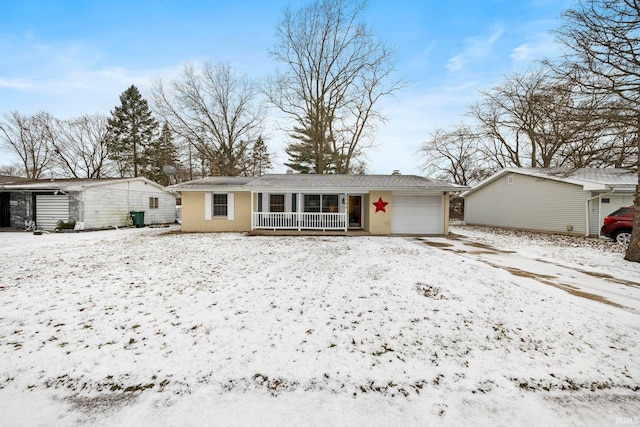 view of front of house with covered porch and a garage