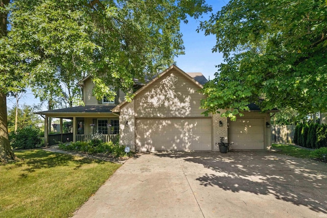 view of front facade featuring a garage, a porch, and a front yard