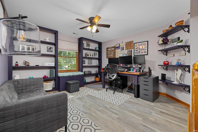 office area with ceiling fan and light hardwood / wood-style floors