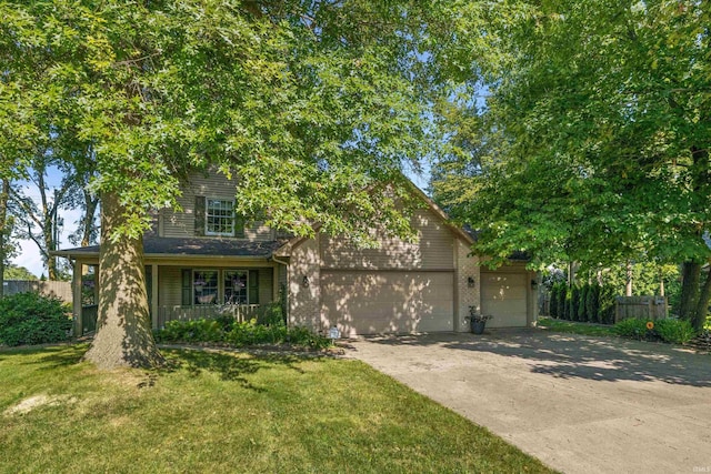 view of front of home featuring a front yard and a garage