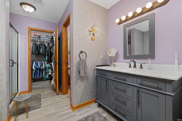 bathroom featuring vanity and hardwood / wood-style flooring