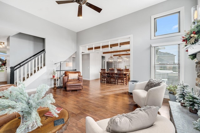 living room with hardwood / wood-style floors and ceiling fan