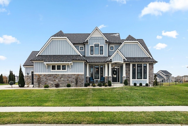 craftsman-style home featuring a front lawn