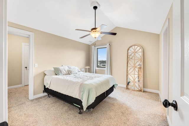 carpeted bedroom featuring vaulted ceiling and ceiling fan