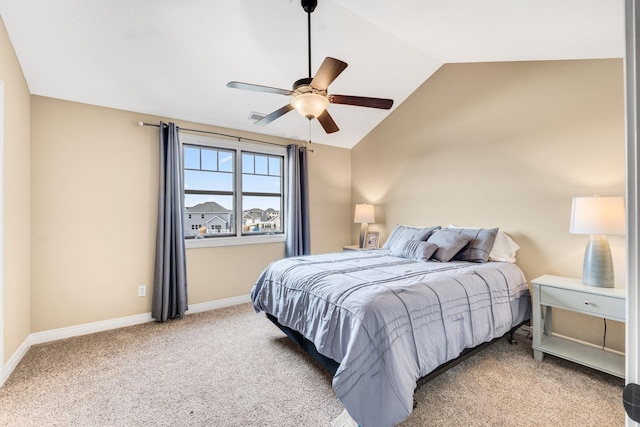 bedroom featuring ceiling fan, light carpet, and vaulted ceiling