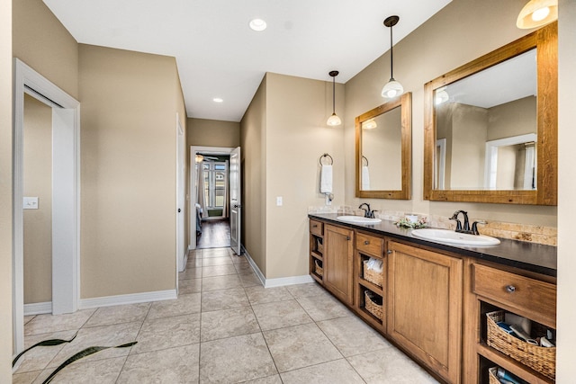 bathroom with tile patterned flooring and vanity