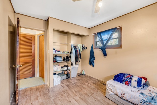 bedroom with ceiling fan and hardwood / wood-style floors