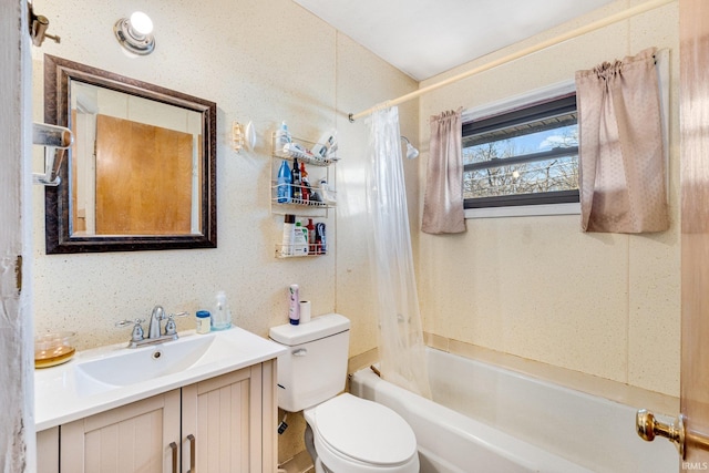 full bathroom with vanity, shower / tub combo, and toilet