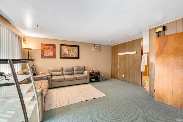 living room with carpet and wooden walls