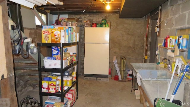 basement featuring white refrigerator