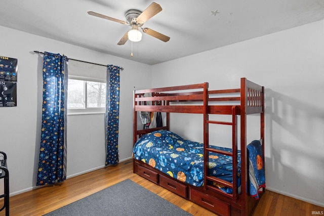 bedroom with ceiling fan and wood-type flooring