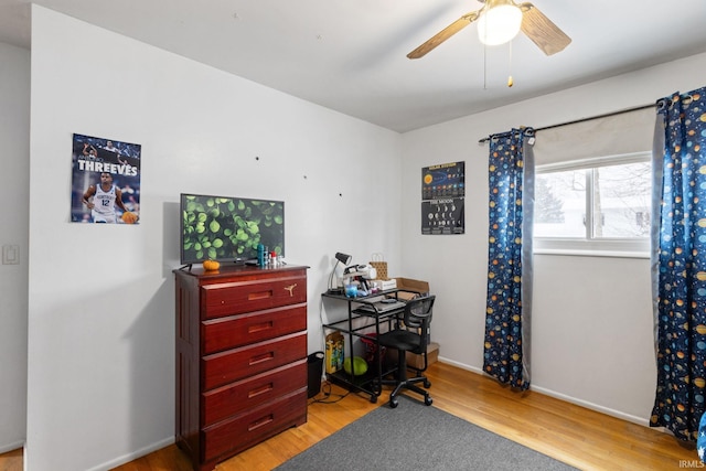 office space with light wood-type flooring and ceiling fan