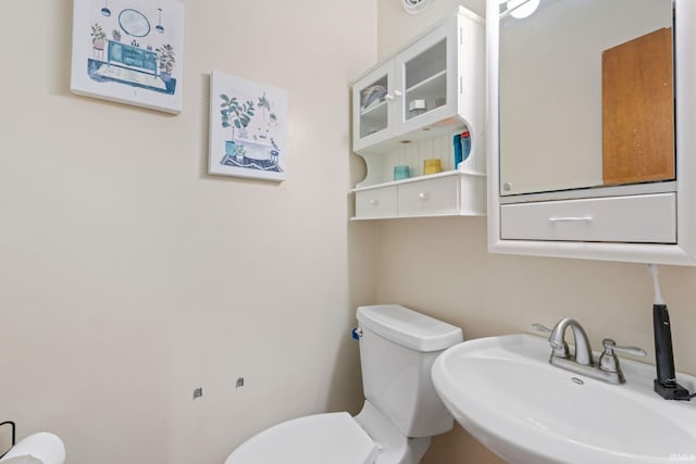 bathroom with sink and toilet