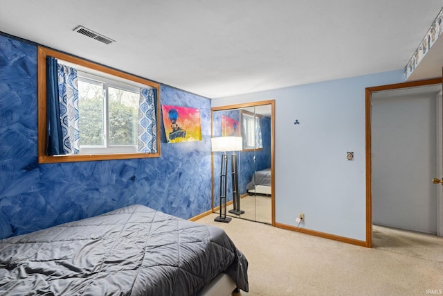 carpeted bedroom with a closet