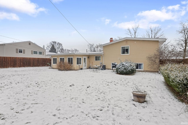 view of snow covered house