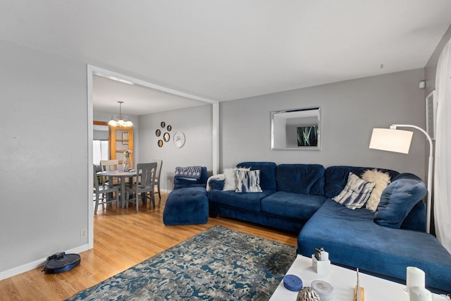 living room with a chandelier and hardwood / wood-style floors